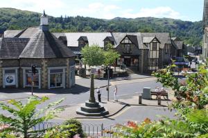 a small town with a street with a building at Chapel Hill Cottage in Ambleside