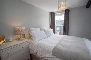 Ένα ή περισσότερα κρεβάτια σε δωμάτιο στο Ashness House