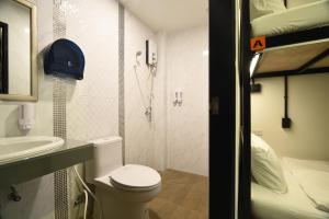 a small bathroom with a toilet and a shower at KOKO Party Hostel 18-40 in Ao Nang Beach +23 photos