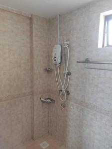 a bathroom with a shower stall with a shower at PD Paradise Lagoon Apartment North B-2-6 in Port Dickson