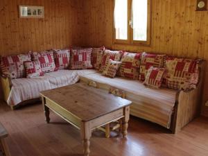 a living room with a couch and a table at Chalet Châtel, 5 pièces, 8 personnes - FR-1-200-212 in Châtel