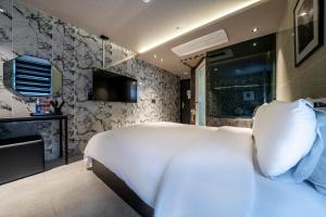 TV a/nebo společenská místnost v ubytování MG Hotel