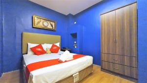 Postel nebo postele na pokoji v ubytování Spiral Suites Hotel