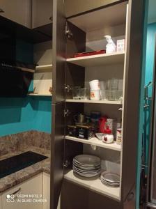 a kitchen pantry with plates and dishes in it at Riga, Jelgavas street 48. in Rīga