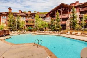 a swimming pool in front of a resort at Powderhorn Lodge 504 Aspen View Villa in Brighton