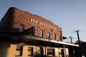 a building with a sign on the side of it at Seven Seas Hotel in Carrington