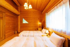 Cama o camas de una habitación en Suite Villa Hakone Sengokuhara Canadian Log