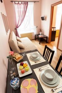 a dining room with a table with food on it at Anturage Hotel in Saint Petersburg