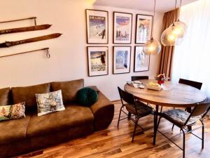 a living room with a couch and a table at Apartment in thermal and winter sports resort of Bad Gastein in Bad Gastein