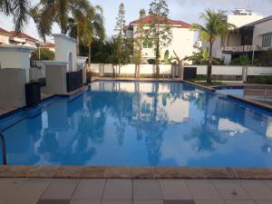 a large swimming pool with blue water at HAPDESKO HOMESTAY in Batam Center