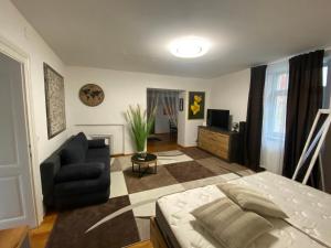 Televízia a/alebo spoločenská miestnosť v ubytovaní B&B bei Pepe Nero.