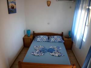 Postel nebo postele na pokoji v ubytování Friendly House
