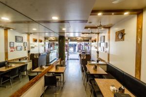 A restaurant or other place to eat at Hotel Vyankatesh & Pure Veg Restaurant