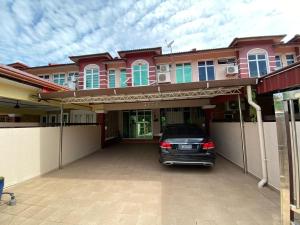 a car parked in front of a house at Homestay LA Kota Bharu in Kota Bharu