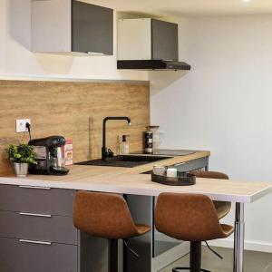 Kuchyňa alebo kuchynka v ubytovaní L’atelier A magnifique Loft avec terrasse privée