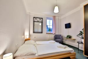 Postel nebo postele na pokoji v ubytování Penzion Výtoň