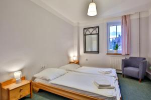 Postel nebo postele na pokoji v ubytování Penzion Výtoň