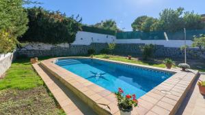 a swimming pool in the backyard of a house at Casa Rural cerca de Granada Otura by Ruralidays in Otura