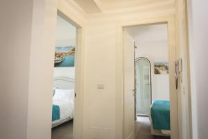 A bed or beds in a room at Le Villette - Taormina