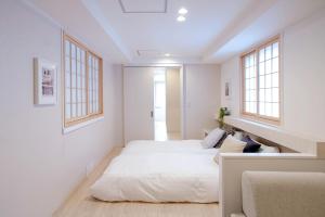 Rúm í herbergi á Asakusa Designer Hotel YOSHII