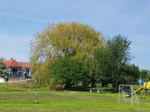 a park with a soccer goal and a playground at Ferien-Residenz am Nationalpark Wohnung 6 in Gingst