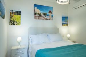 A bed or beds in a room at Le Villette - Taormina
