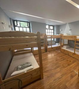 a large room with two bunk beds in it at Greg&Tom Party Hostel in Krakow