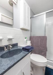 a white bathroom with a toilet and a sink at Summer Deal! Air Force 1 Heroes Home - Sheppard AFB Wichita Falls in Wichita Falls