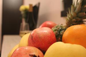 a pile of apples oranges and other fruits on a table at Guest House Stels in Kranevo