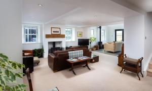 a living room with a couch and a table at Beck View in Troutbeck