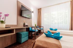 TV a/nebo společenská místnost v ubytování Hotel Orizont