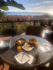 a table with food on top of a balcony at Atalaya Dreams in Mojácar