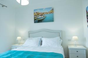 A bed or beds in a room at Le Villette - Taormina