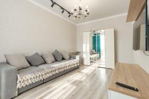 a living room with a couch and a table at Salem in Zaozërnyy