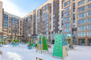 a playground in front of a large building at Salem in Zaozërnyy