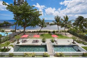 an aerial view of a resort with two pools and a beach at Les Estivales Beachfront Suites & Penthouses by LOV in Trou aux Biches