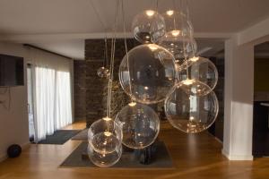 a bunch of glass balls hanging from a ceiling at VILA ESCAPE - Pe Malul Lacului Firiza,Maramures in Baia Mare