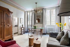 a living room with a couch and a table at BorgoDeGreci Apartments in Florence