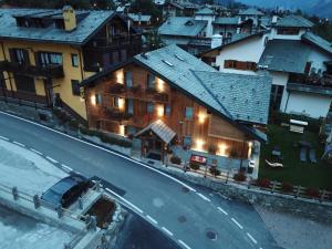 a truck is parked in front of a house at L'Abri des Amis in Courmayeur