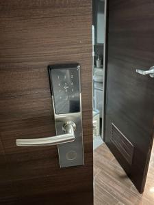 a close up of a door with a handle at Apartment in Air Residences, Makati with wifi, Netflix, pool, mall and more in Manila