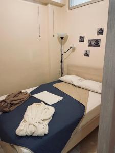 A bed or beds in a room at G&M Luxury Studios