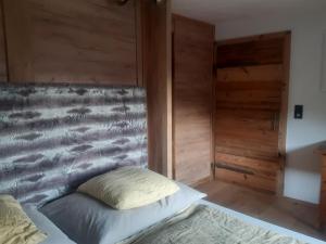 Postel nebo postele na pokoji v ubytování Hüttenzauber