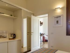 a bedroom with a mirror and a bed in a room at TENUTAYALA - Residenza Agrituristica in Parabita