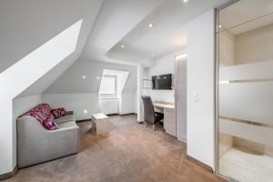 TV a/nebo společenská místnost v ubytování Hotel Garni Christine