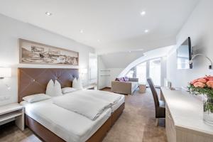 Postel nebo postele na pokoji v ubytování Hotel Garni Christine