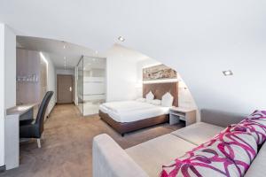 Postel nebo postele na pokoji v ubytování Hotel Garni Christine