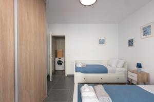 Postel nebo postele na pokoji v ubytování Greek Sky - New modern apartment with shared pool