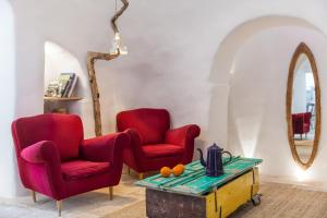 Uma área de estar em Trulli 18cinquantanove