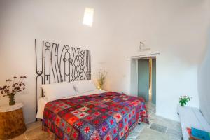 Uma cama ou camas num quarto em Trulli 18cinquantanove