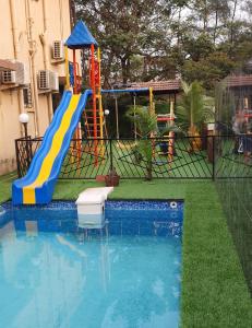 a playground with a slide and a slide at Mount Bungalows-Mount Paradise-6BHK-PVTPOOL in Lonavala